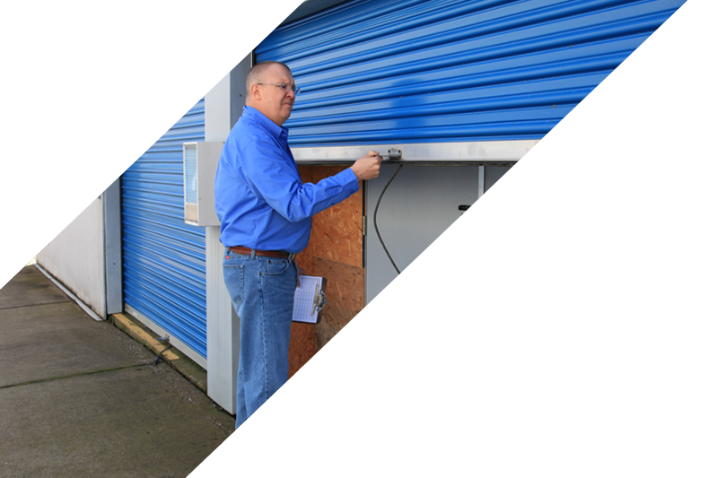 slash-climate Photo of Service Representative locking the door to a storage container